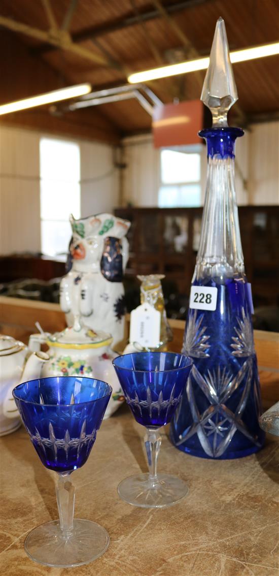 Blue overlay flash cut conical decanter and a pair of glasses
